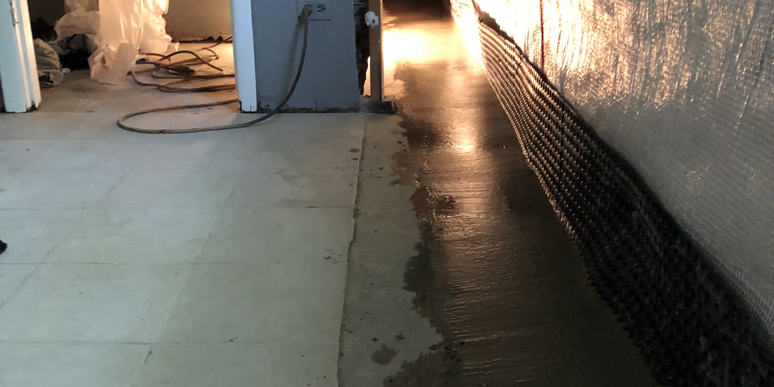 Interior Drain Tile Finished Concrete Pour with Mel-Drain and Fiber Plastic on Walls