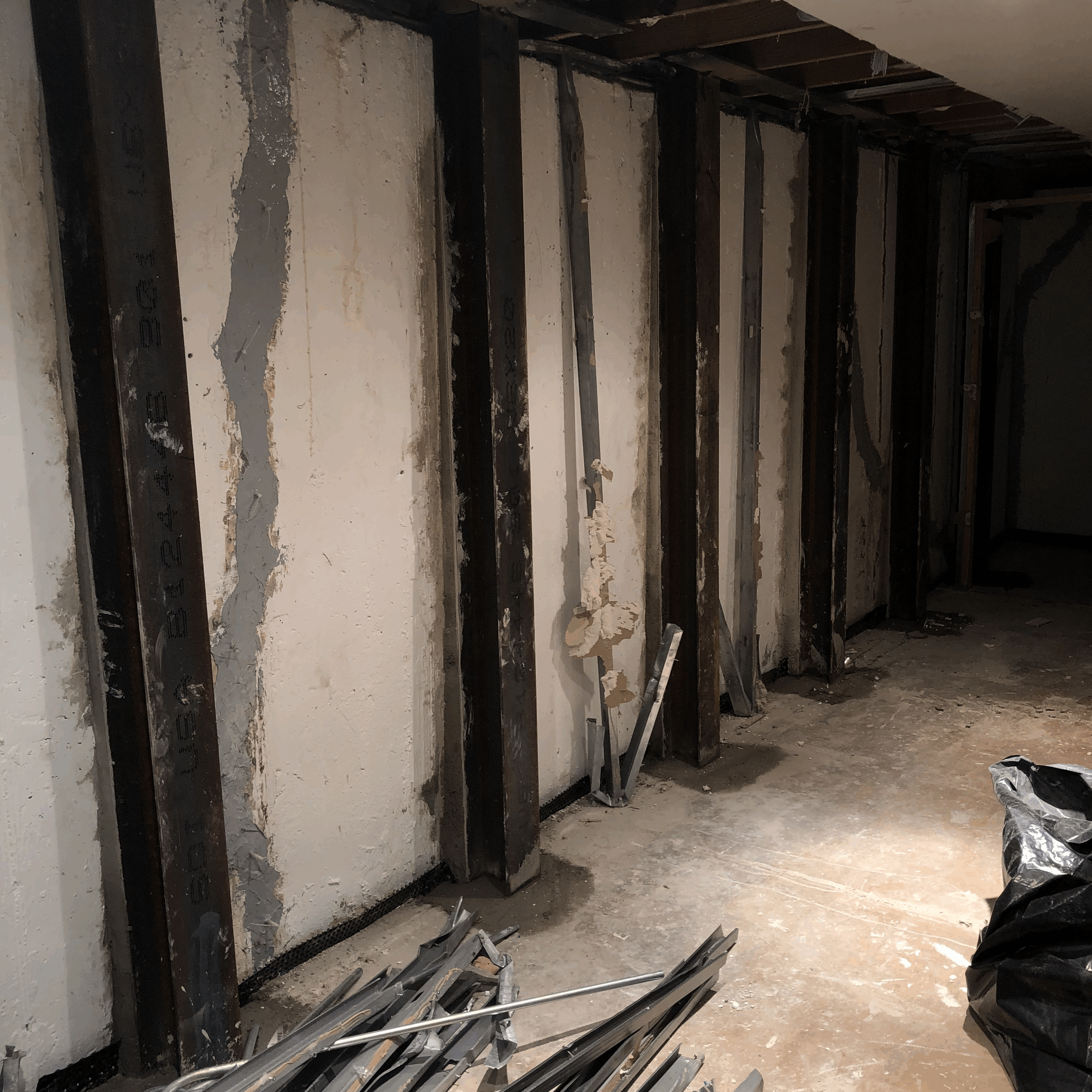 Wall Bracing Vertical Steel I-Beams Waterproofing Cracks using Epoxy Injection